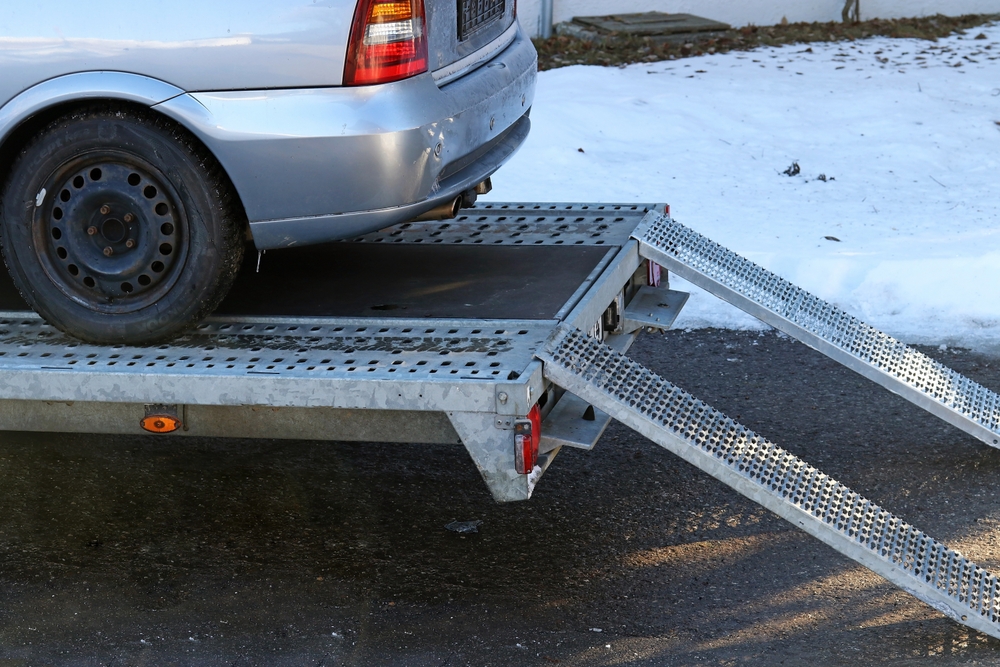 An older car was loaded onto a trailer