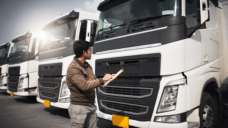 Truck Driver is Checking the Semi Truck's Engine Maintenance Repairing Checklist. Repairman Auto Service Shop. Inspection Safety Before Driving. Shipping Cargo Freight Truck Transport Logistics.