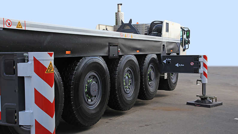 Close up of wheels of heavy truck with a platform